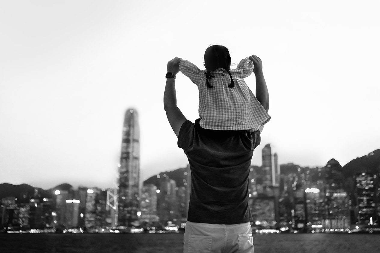 Two people overlooking bay