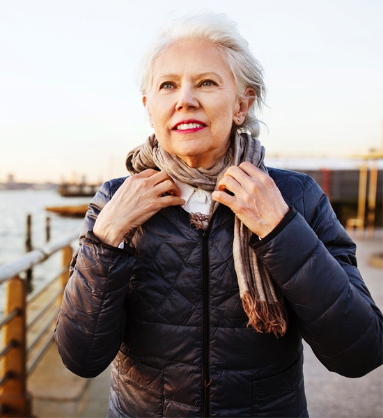 Elder woman on a bridge